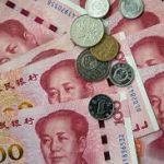  Chinese Yuan weakens to 7.0298 against dollar